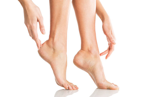 Applying body lotion to your feet.