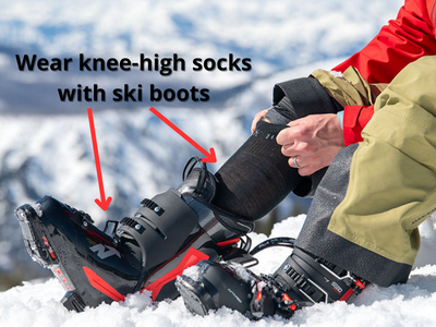 Wear knee-high socks with ski boots
