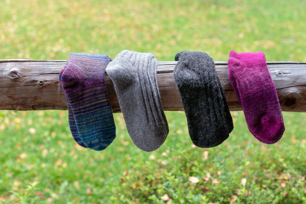 How to take care of hiking socks? Hang them on the rack and let them dry on air.